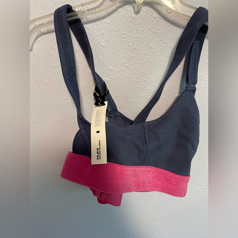 Brand New she fit sports bra. Size large with Velcro tighteners.